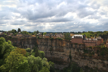 Under a threatening August sky, a panoramic view of the village overlooking the Trou de Bozouls...