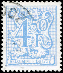 Postage stamp issued in Belgium the image of the Number on Heraldic Lion, circa 1974