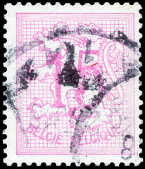 Postage stamp issued in Belgium the image of the Number 15 on Heraldic Lion, circa 1959