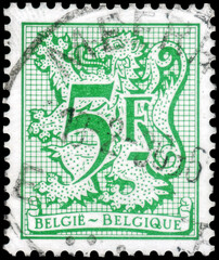 Postage stamp issued in Belgium the image of the Number 5 on Heraldic Lion, circa 1982