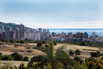 Extensive panoramic view of Benidorm, Spain with
the skyline and the sea in the background from the extraordinary golf courses that surround the city