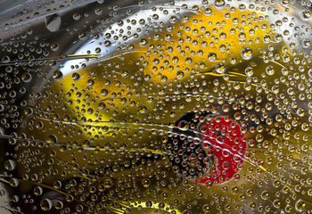 Transparent spheres are located on a gold background with black and red silhouettes of Yin-Yang...