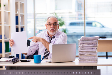 Fototapeta premium Aged businessman employee unhappy with excessive work