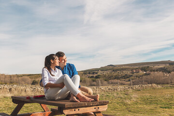 Young couple  Hugging, kissing and enjoying spending time together while celebrating Saint...