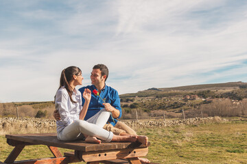 Young couple  Hugging, kissing and enjoying spending time together while celebrating Saint...