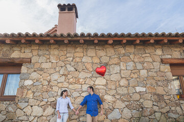 Young couple  Hugging, kissing and enjoying spending time together while celebrating Saint Valentine's Day in the countryside. Love san valentin and Relationship concept.