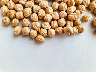 Uncooked dried chickpeas. Top view. Food background. Heap of legume chickpeas background 