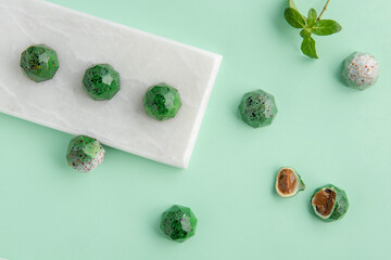 Chocolates on a green background