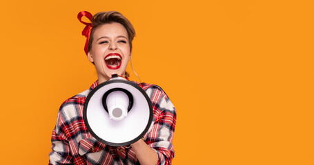 Smiling happy pinup woman screaming through megaphone.