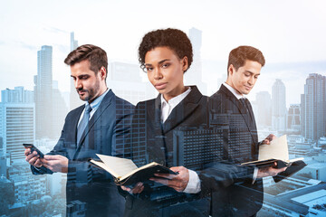 Group of three business colleagues in suits working on project together to gain new career...
