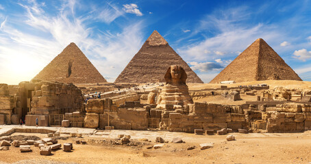 Gorgeous Sphinx in front of the Giza Pyramids, famous Wonder of the World, Egypt - obrazy, fototapety, plakaty