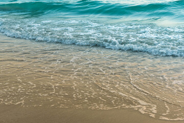 Nature in twilight period which including of sunrise over the sea and the nice beach. Summer beach with blue water and purple sky at the sunset.