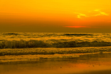 Nature in twilight period which including of sunrise over the sea and the nice beach. Summer beach with blue water and purple sky at the sunset.