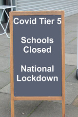 Covid tier 5 Schools closed, national lockdown on a chalk board