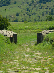 Ruins of a roman castrum gate and road in the old roman city Porolissum. Old Dacia province. Romania.