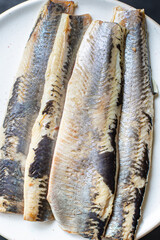 herring fresh whole fish or salted seafood ready to cook and eat on the table pescetarian diet healthy meal outdoor top view copy space food background rustic image 