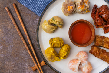 various variants of dim sum in ceramic plates