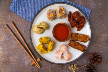 various variants of dim sum in ceramic plates