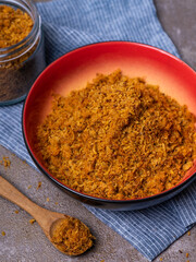 shredded chicken served in a glass jar and read bowl