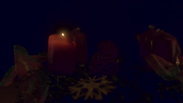 Closeup of an advent wreath with one candle burning