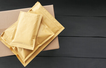 Two different size of paper envelopes on the wooden table