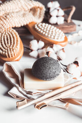 Natural brushes made of wood and soap on the background of concrete, bamboo toothbrushes PNOV2019