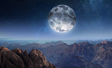 Fototapeta na wymiar Abstract landscape with mountains and full Moon in starry sky. Planet. Nebula and deep space. Elements of this image furnished by NASA
