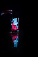 Pouring red wine on the rocks