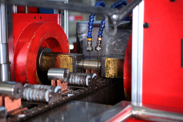 Applying lubricant to finished bearings. Preservation and packing of bearings. Out of focus. Heavy...