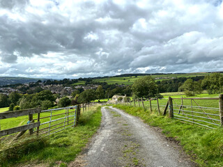 Fototapeta na wymiar Rural landscape, with fields, trees, and heavy rain clouds near, East Morton, Keighley, UK