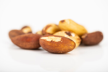 Group of brazil nuts on a white background. Side view