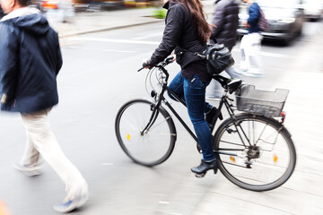 bicycle rider crossing a city street