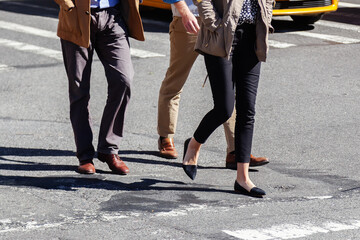 business people walking on a city road