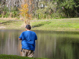 Man Fishing in pond