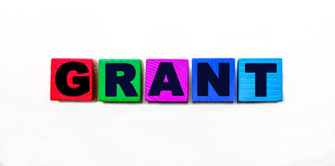 The word GRANT is written on colorful cubes on a light background