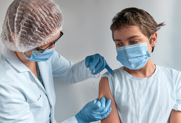 Coronavirus, flu or measles vaccine concept. Medic, doctor or nurse in protective gown and face...