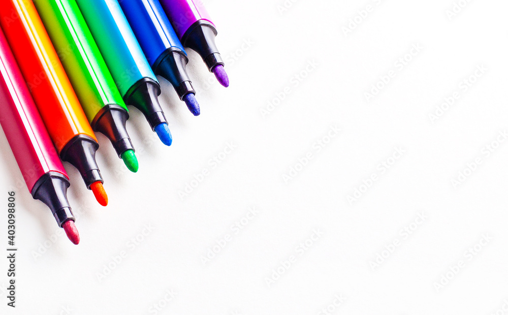 Poster Multicolored open markers on a white background. Place to insert text