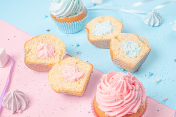 decor for a party to recognize the gender of the unborn child. muffins with blue and pink filling