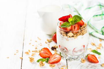 Greek yogurt with fresh strawberry and granola. Parfait.