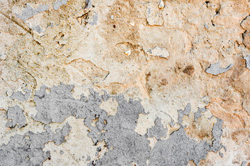Texture of a concrete wall with cracks and scratches which can be used as a background