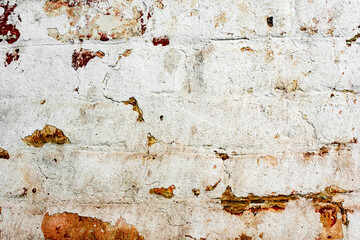 Texture of a brick wall with cracks and scratches which can be used as a background