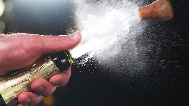 Champagne splashes on black background