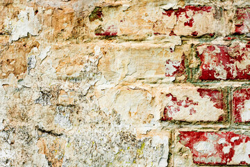 Texture of a brick wall with cracks and scratches which can be used as a background