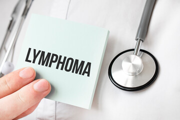 Doctor holding card in hands and pointing the word LYMPHOMA