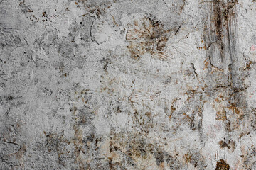 Texture of a concrete wall with cracks and scratches which can be used as a background
