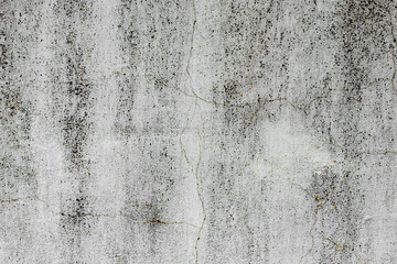 Texture of a concrete wall with cracks and scratches which can be used as a background