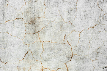 Texture of a concrete wall with cracks and scratches which can be used as a background