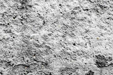 Texture of a concrete wall with cracks and scratches which can be used as a background