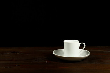 white coffee cup on dark background