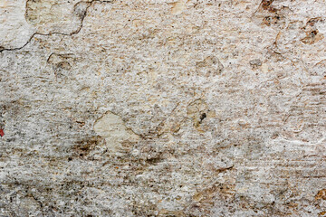 Texture of a concrete wall with cracks and scratches which can be used as a background